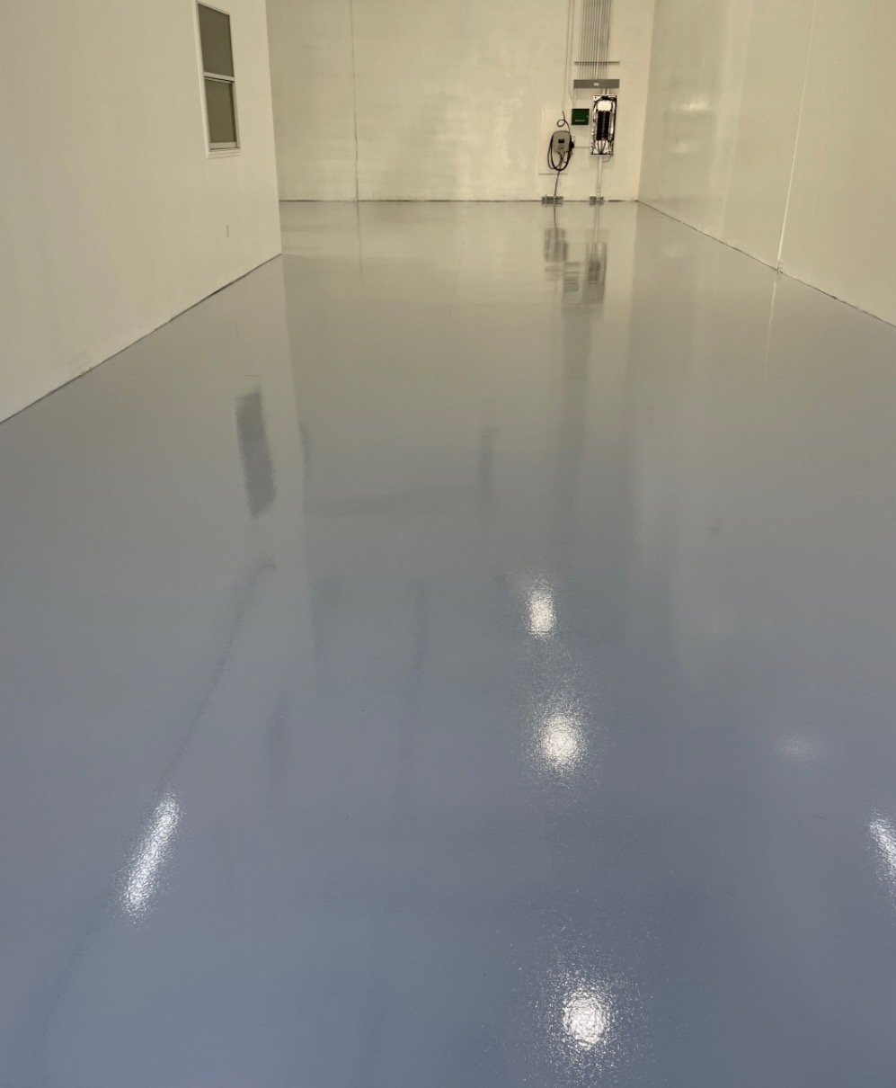Commercial bay — solid blue-gray high-gloss epoxy floor