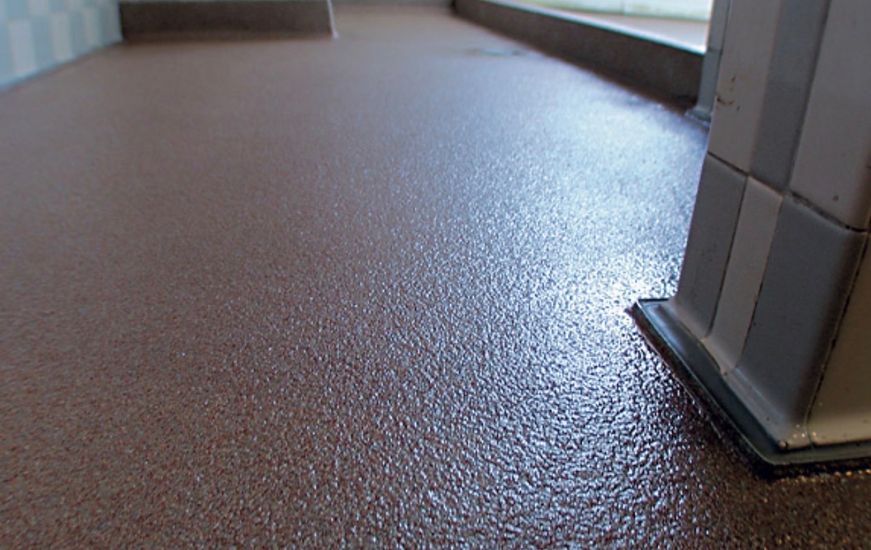 Quartz flooring system — terracotta textured surface close-up